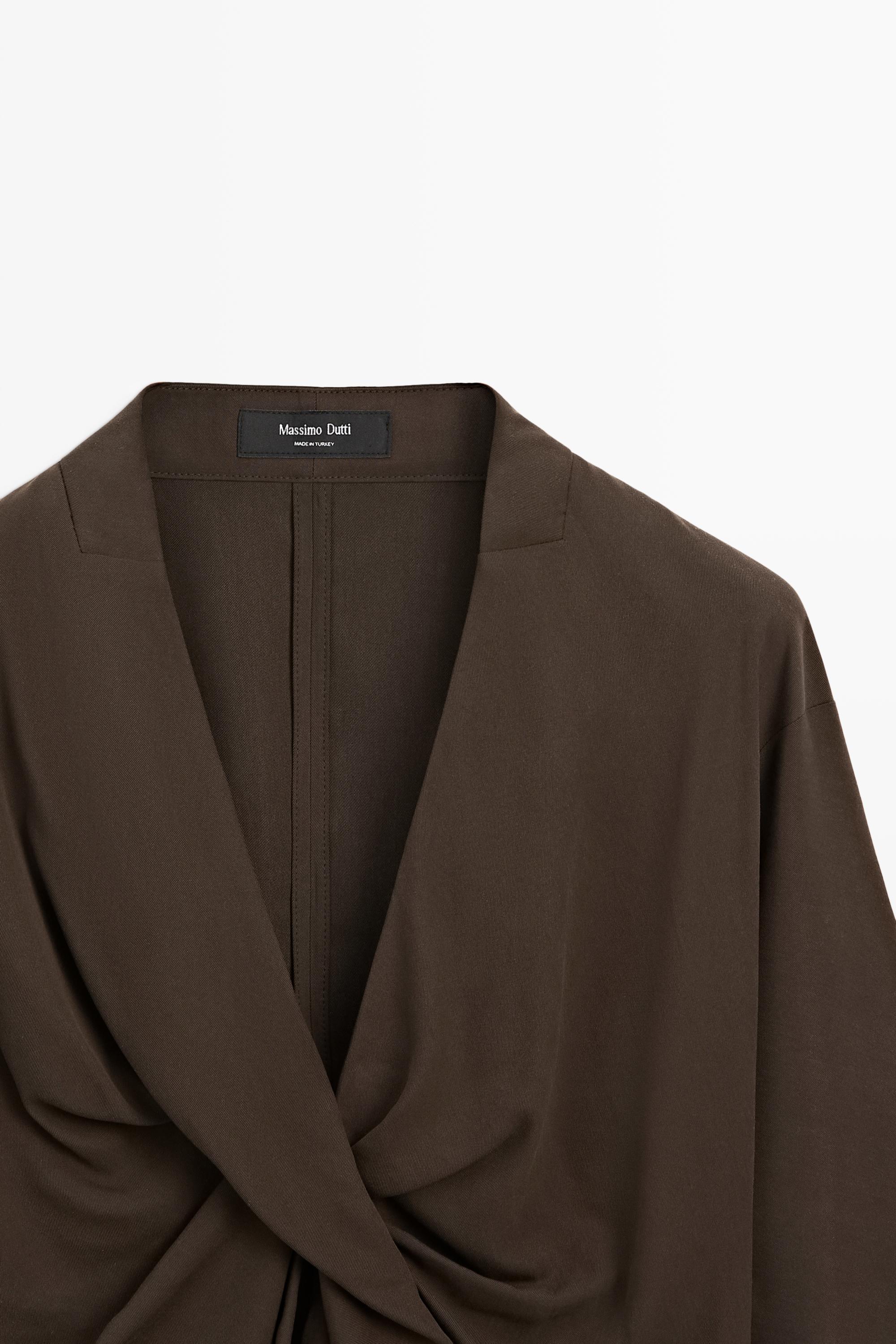 Flowing blouse with draped detail